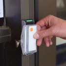 Person presents AggieAccess card to reader